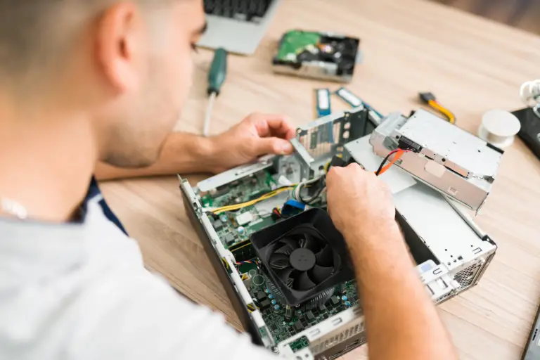 top-view-hispanic-technician-fixing-computer-fan-young-man-connecting-new-component-part-cpu (1)